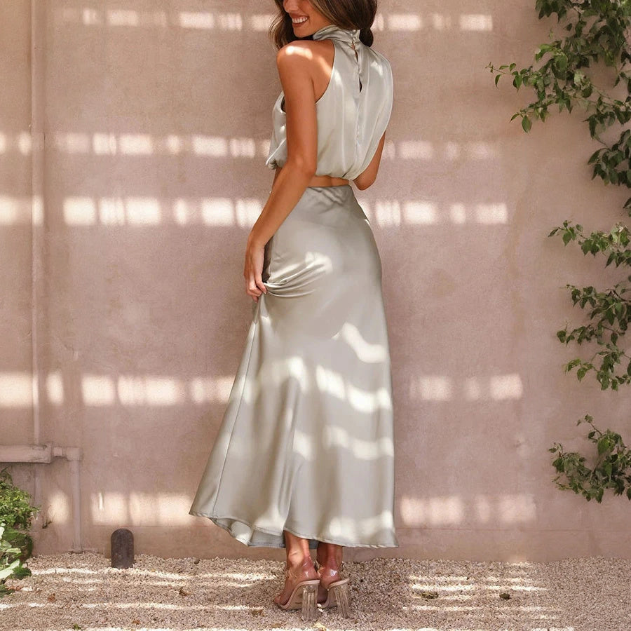 Abito Elegante con Top Halter e Gonna Fluttuante